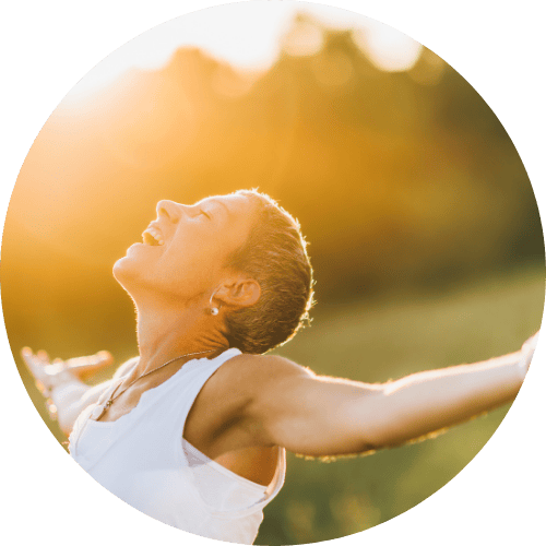 Woman embracing nature and freedom as part of her soulful awakening journey