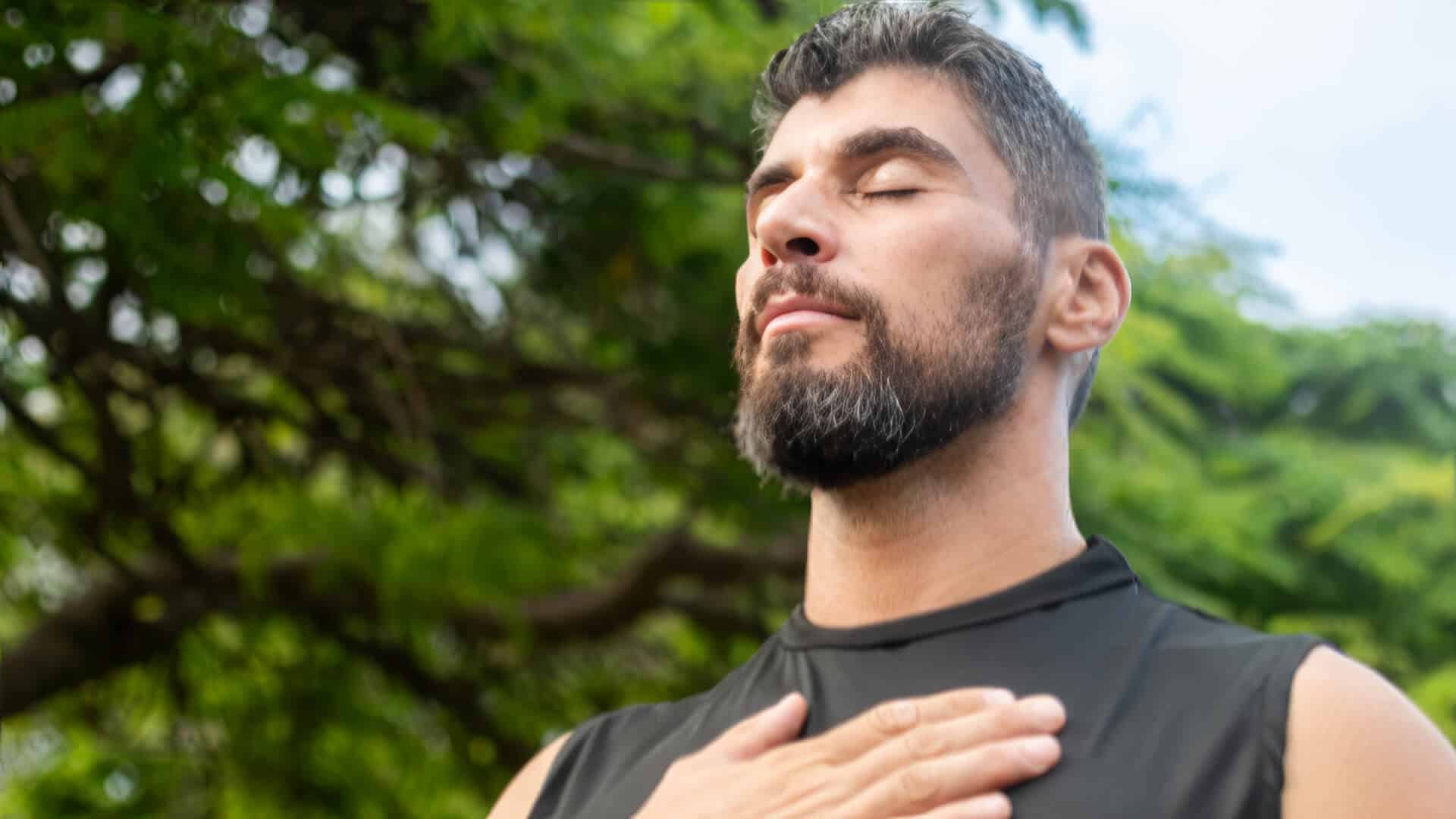 Man with hand on heart